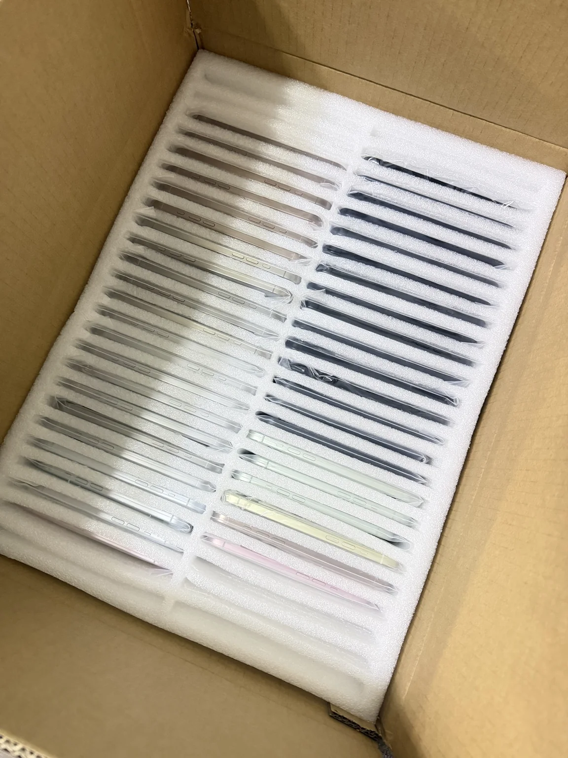 Bulk mobile phones packed with protective foam